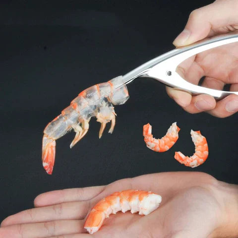 Shrimp peeling tool with shrimp in hand, showcasing easy shell removal.
