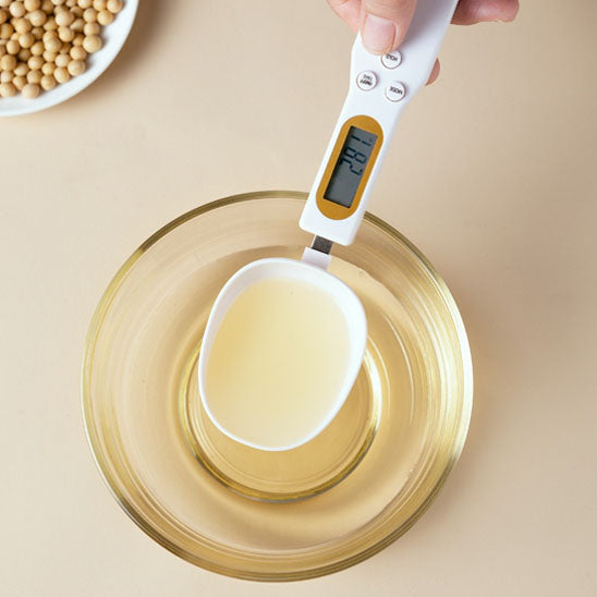 Cuillère doseuse pour peser liquide